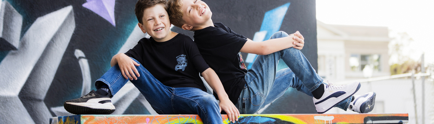 Brothers having fun during a family portrait session in downtown town Santa Ana Art District