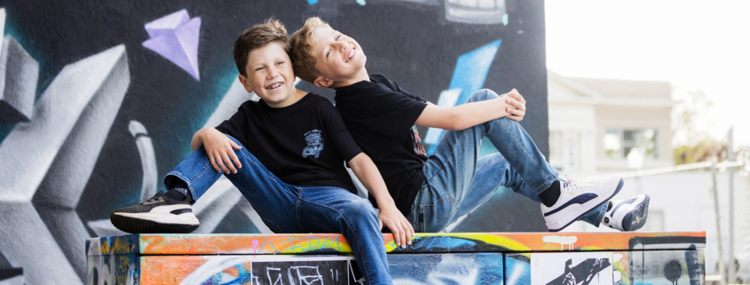 Brothers having fun during a family portrait session in downtown town Santa Ana Art District