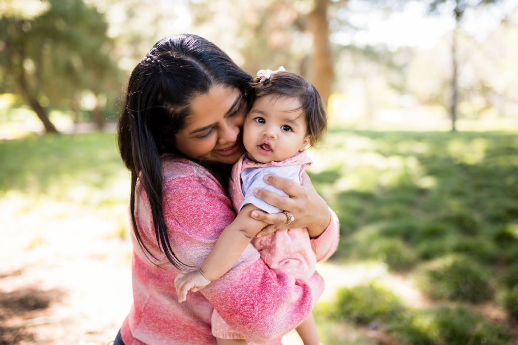 Mother hugging her baby in their family photography