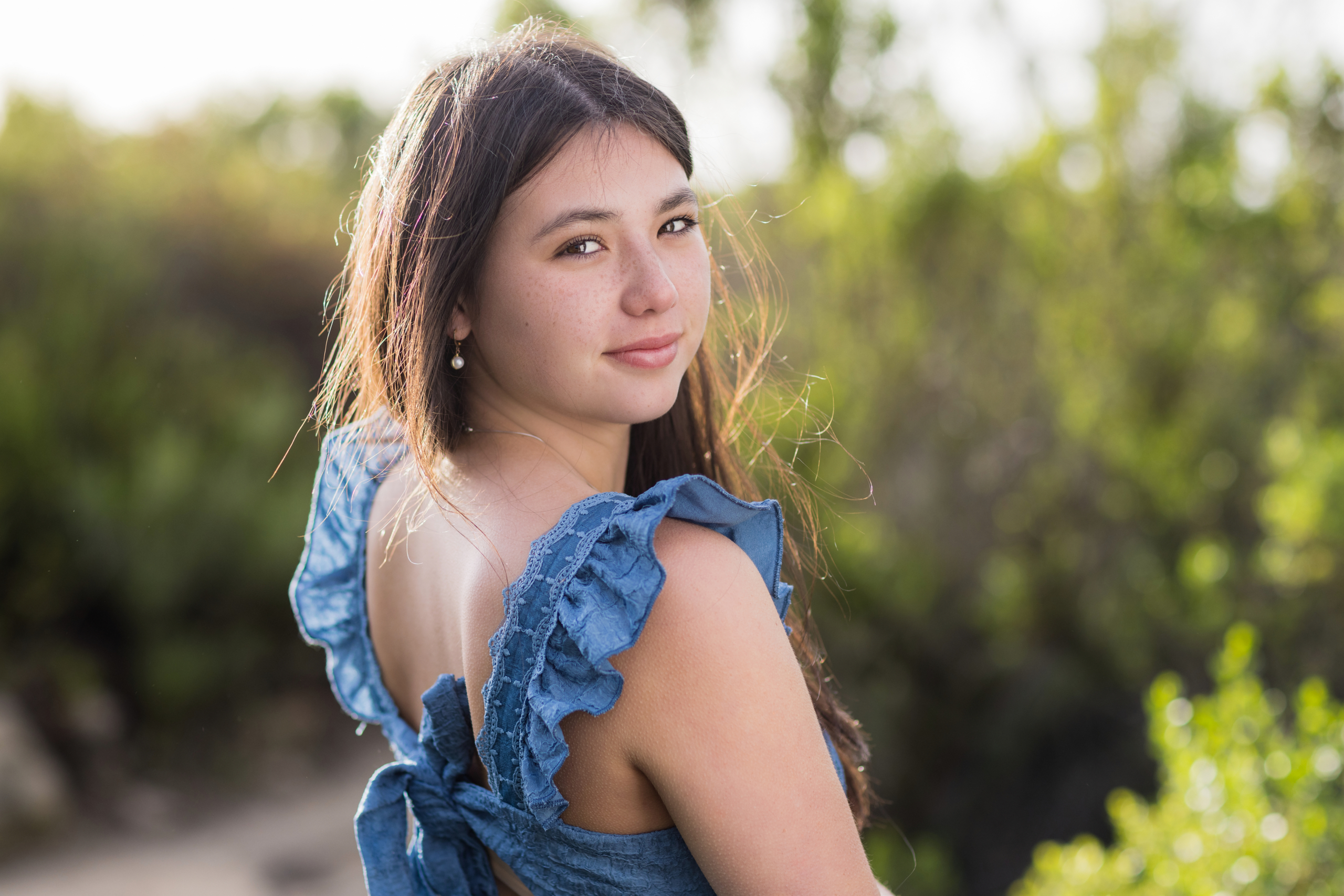 High school senior daughter posing with a natural, relaxed expression.