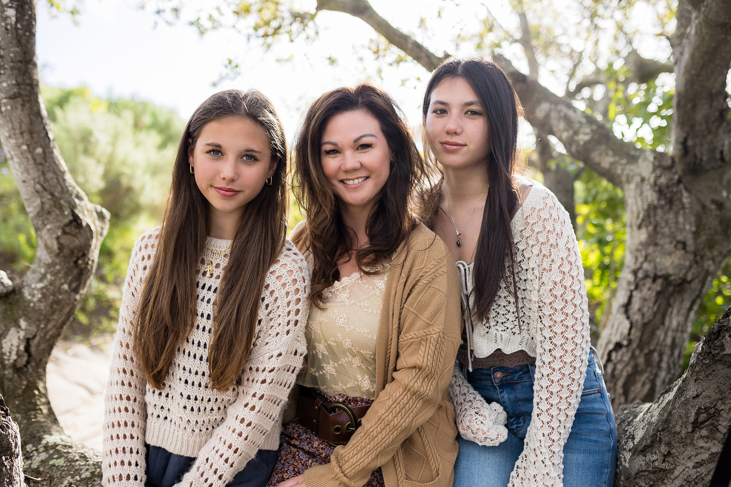 Mom with two daughters at a family photography session at Alta Laguna Park in Laguna Beach