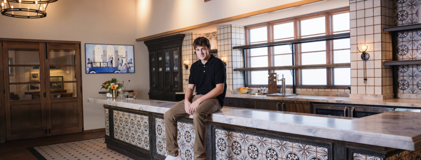 An urban-themed senior portrait of a student posing confidently