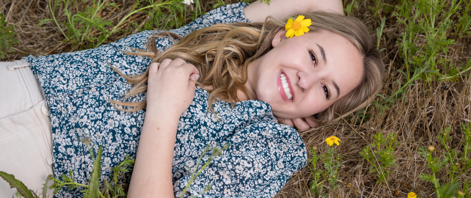 Senior photo session in Orange County flower field. Relaxed poses 