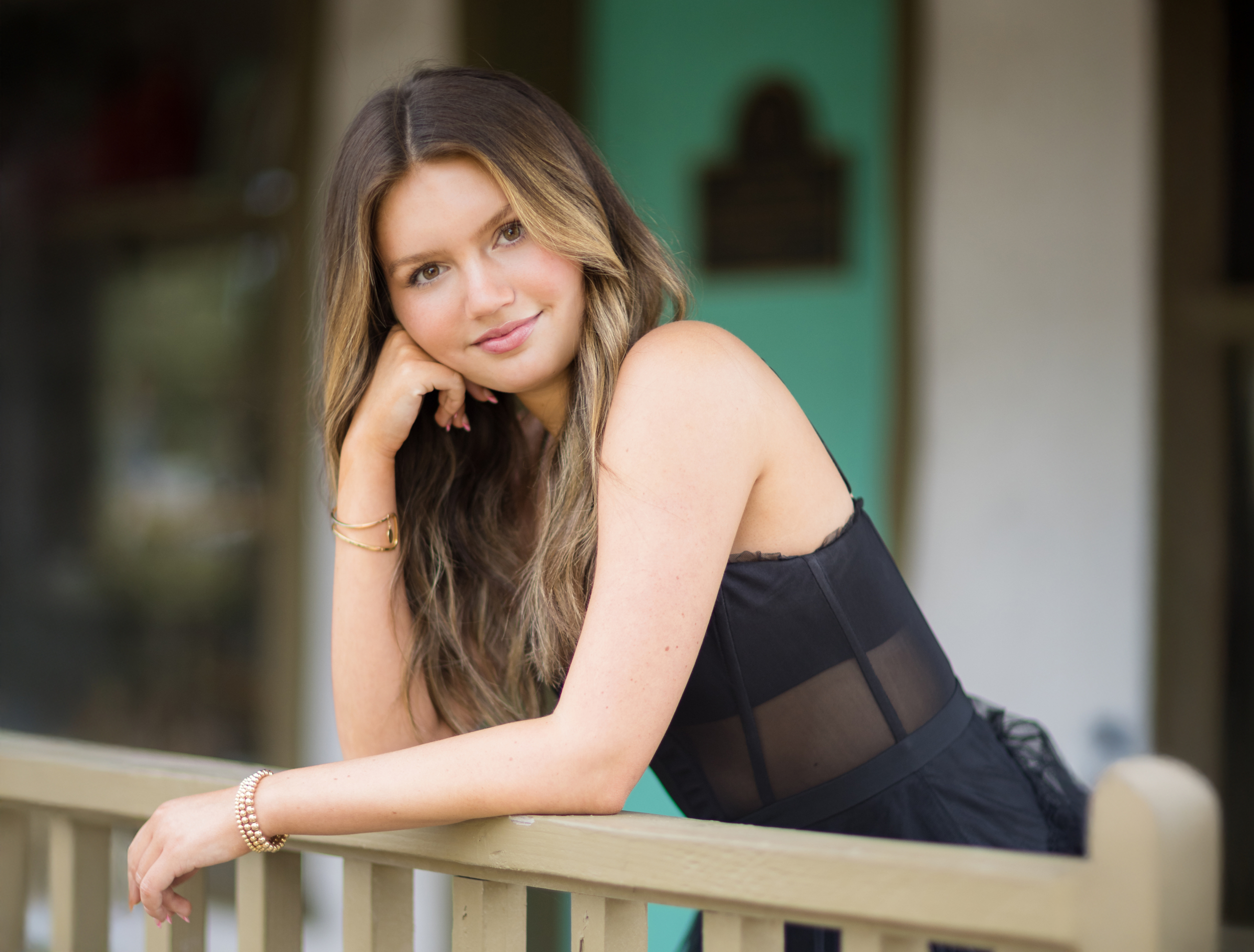 A classic and elegant senior portrait with a charming urban backdrop in Orange County.